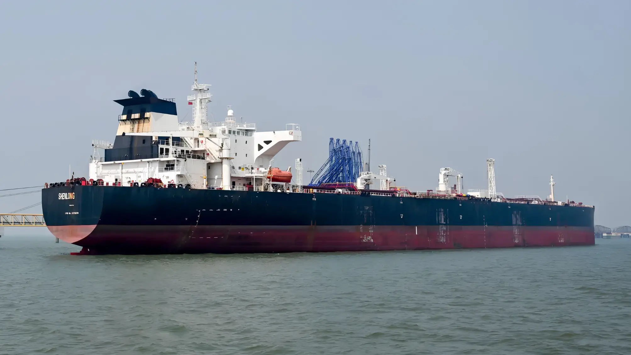 Military tensions escalate in the Strait of Hormuz following US airstrikes on Iran and reported explosions involving two oil tankers.