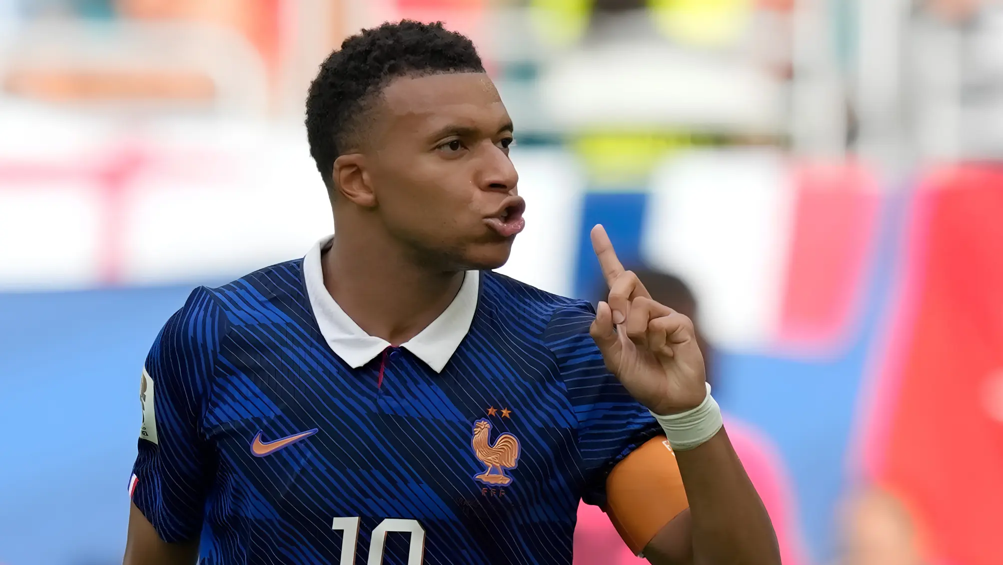 Kylian Mbappe celebrating after scoring for France against England in the 2026 FIFA World Cup third-place playoff to become the tournament's all-time leading goalscorer.