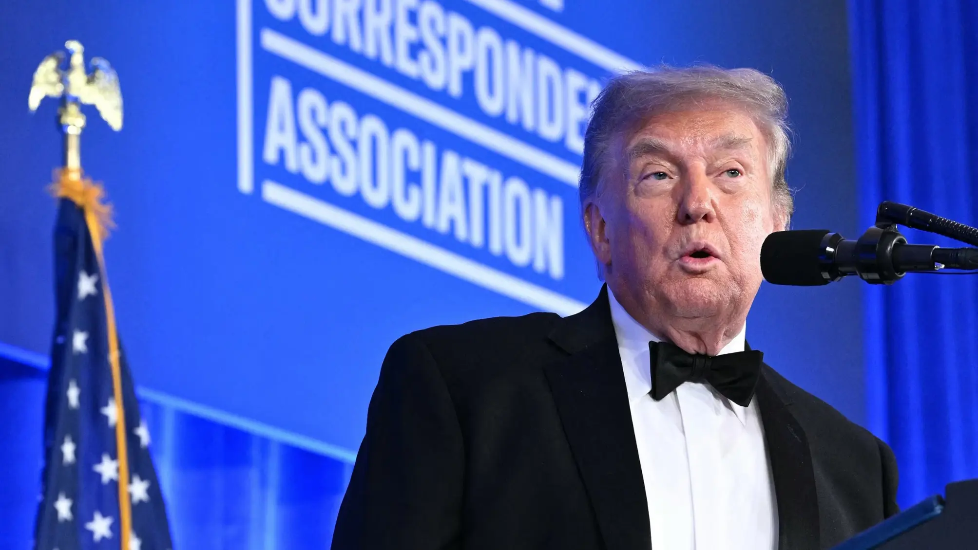 President Donald Trump speaking at the rescheduled White House Correspondents' Dinner following heightened security arrangements.