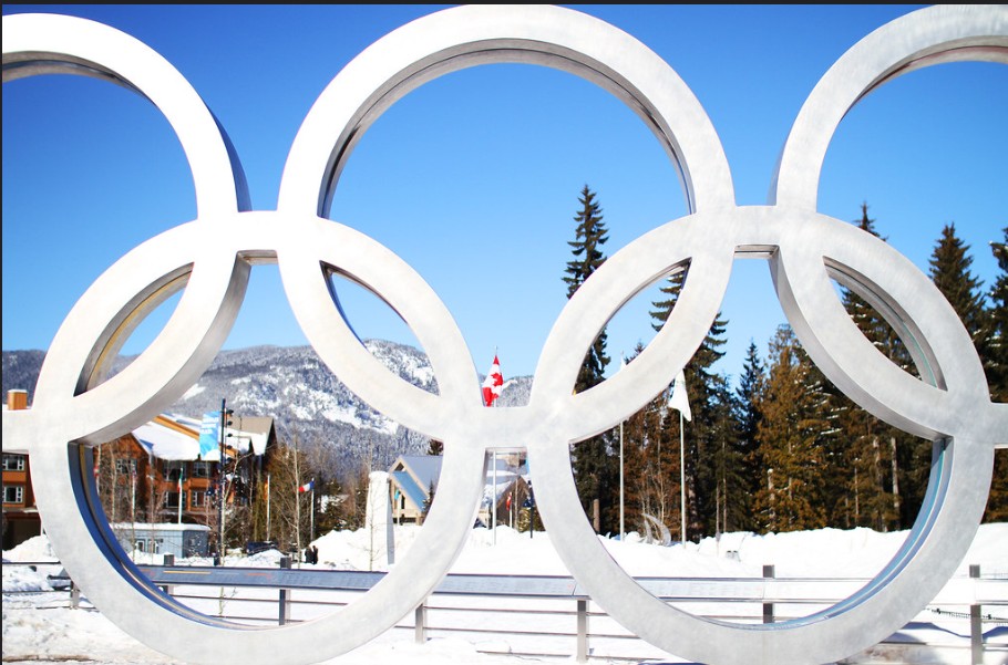 "Chloe Kim performs a trick in the women's snowboard halfpipe final at the 2026 Winter Olympics in Milan-Cortina"