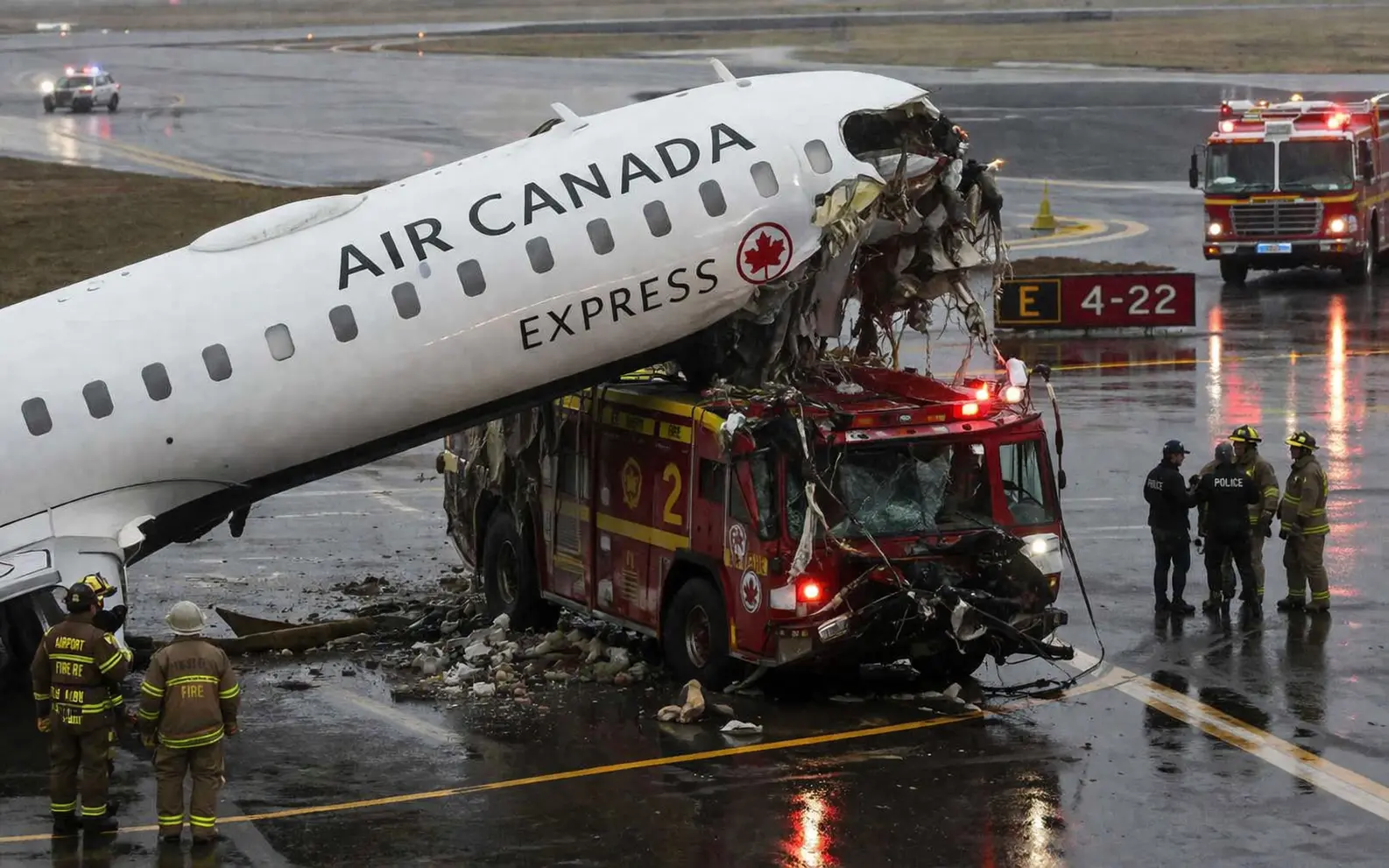 Canada airplane fire truck collision at airport runway with emergency response teams