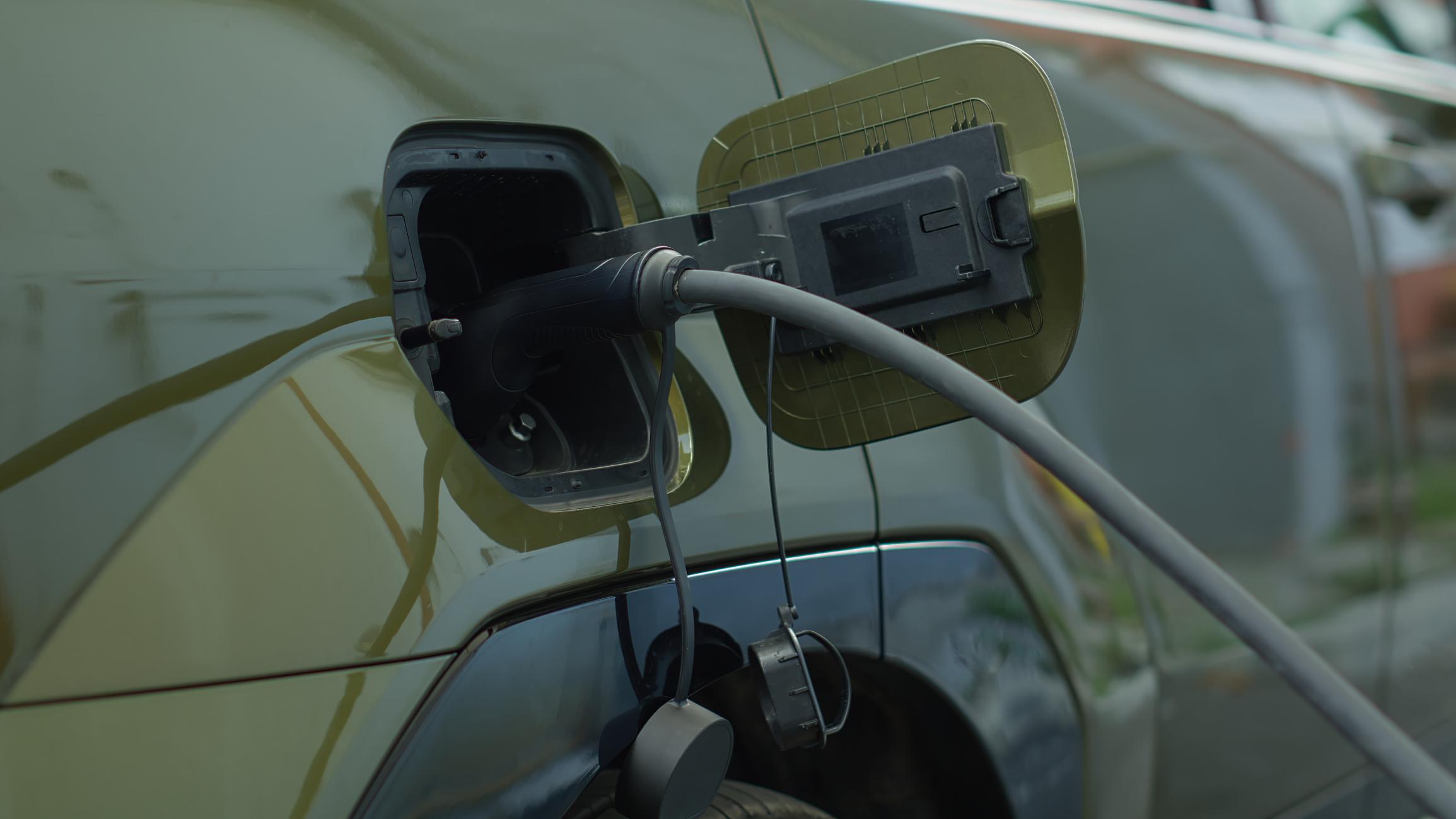 electric cars during high fuel prices charging station scene