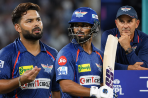Rishabh Pant and Nicholas Pooran during an IPL match as LSG coach Justin Langer looks on from the dugout