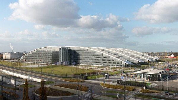 NATO headquarters with member flags amid discussion on Spain suspension reports