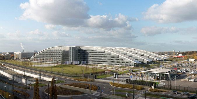 NATO headquarters with member flags amid discussion on Spain suspension reports