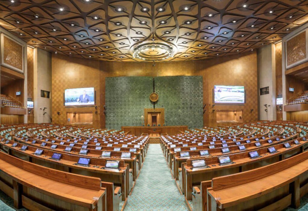 Indian Parliament building with electoral constituency map overlay representing delimitation debate