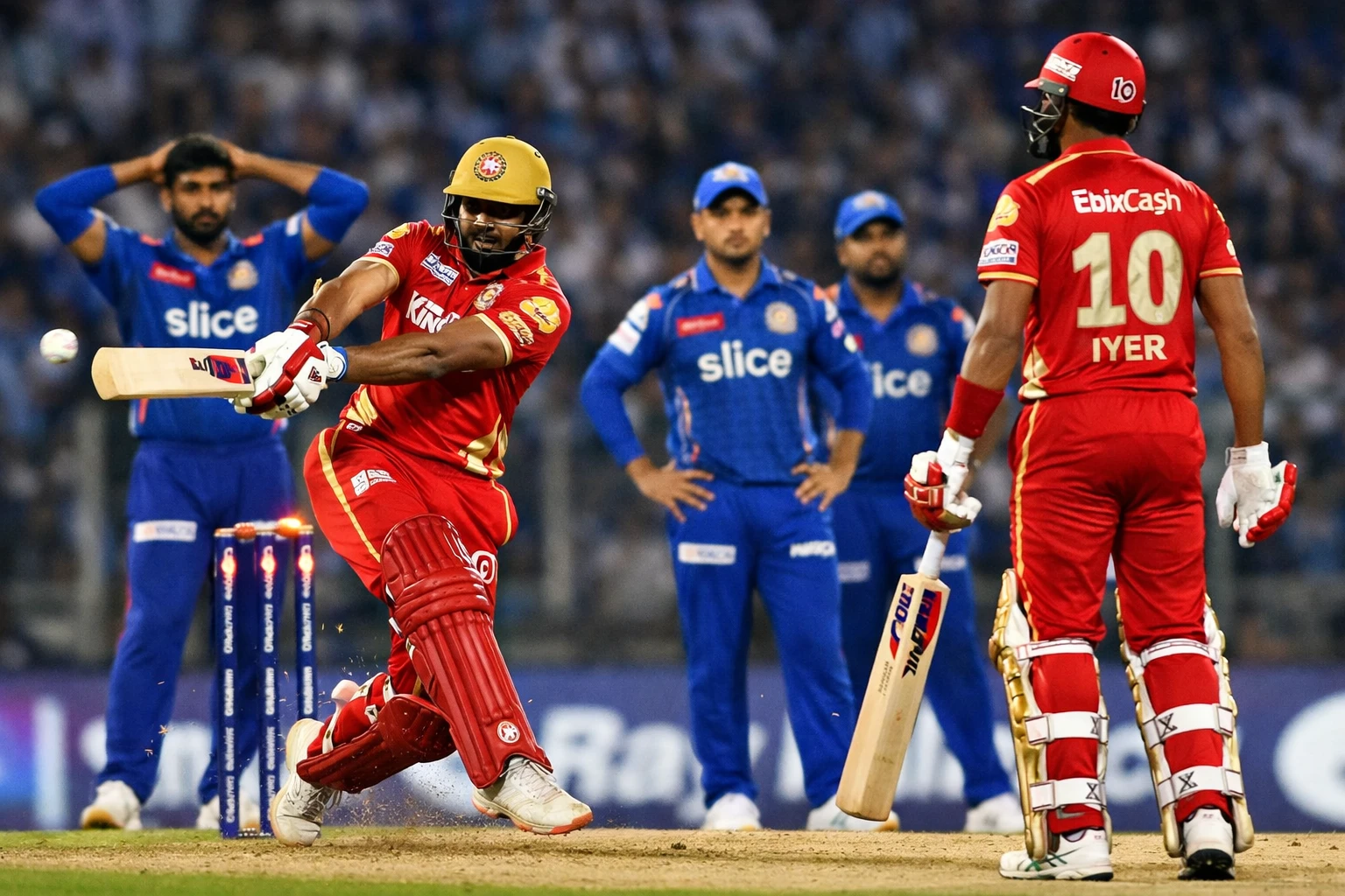 Prabhsimran Singh playing an aggressive shot while Shreyas Iyer watches during PBKS vs MI IPL match under stadium lights.